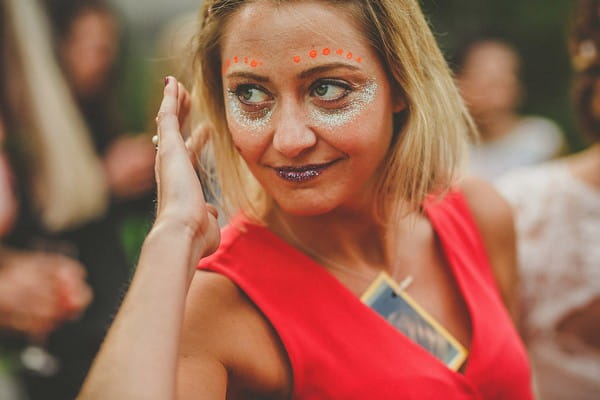 Wedding guest with face painted