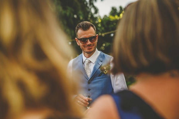 Groom wearing sunglasses