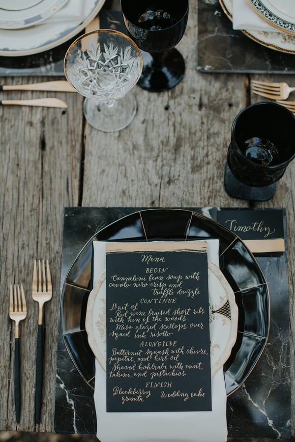 Black wedding menu at place setting