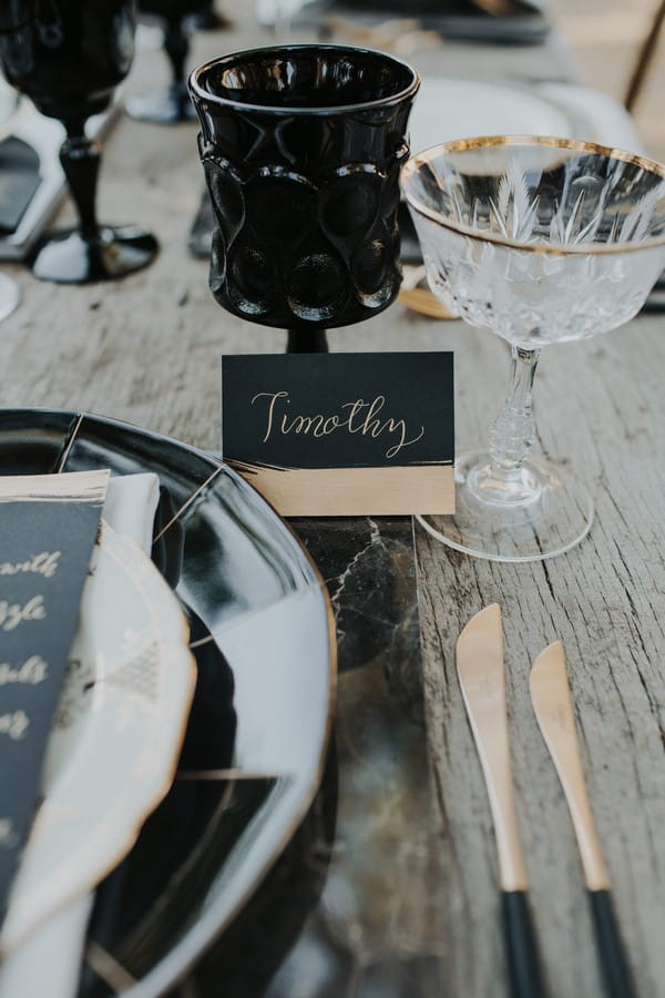 Black wedding name card with gold writing