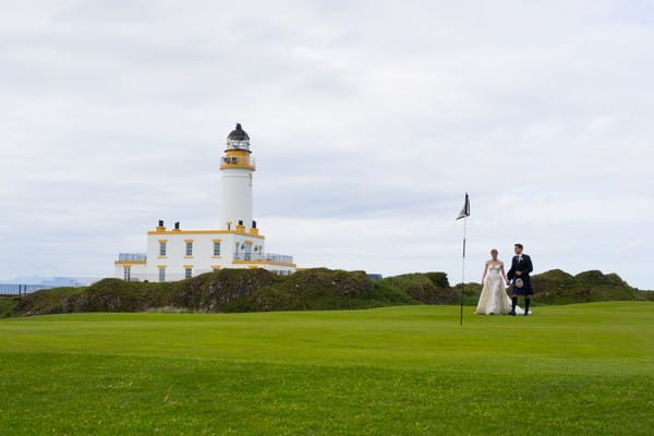 Bride and groom on golf course at Trump Turnberry