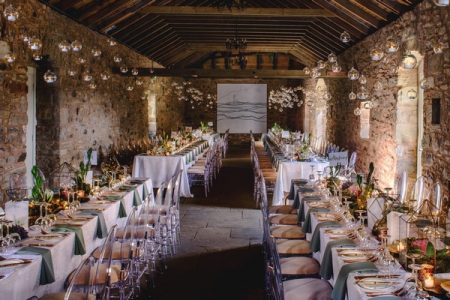 Tea Lights in Glass Baubles Suspended from Ceiling of Wedding Venue