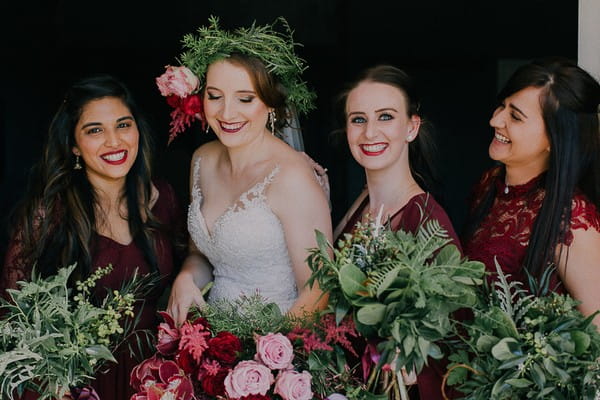 Bride with bridesmaids in maroon dresses