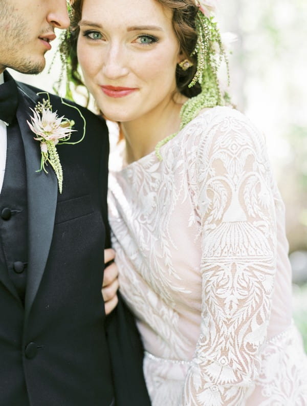 Bride wearing lace detailed wedding dress