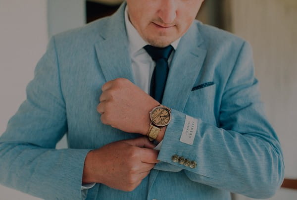 Groom putting watch on