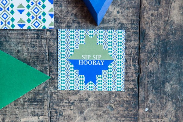 Blue and green geometric wedding stationery