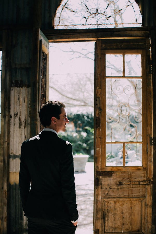 Groom by door of chapel at The Simondium Country Lodge