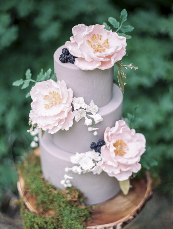 Lavender coloured wedding cake with sugar flowers