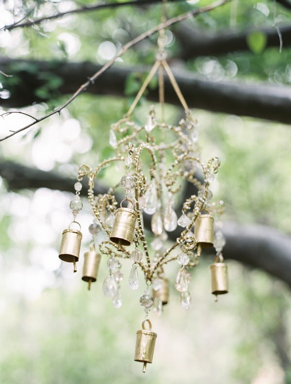 Gold decorations hanging from tree branches