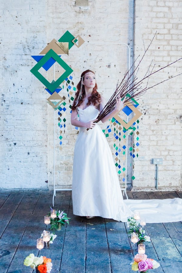 Bride holding twig bouquet