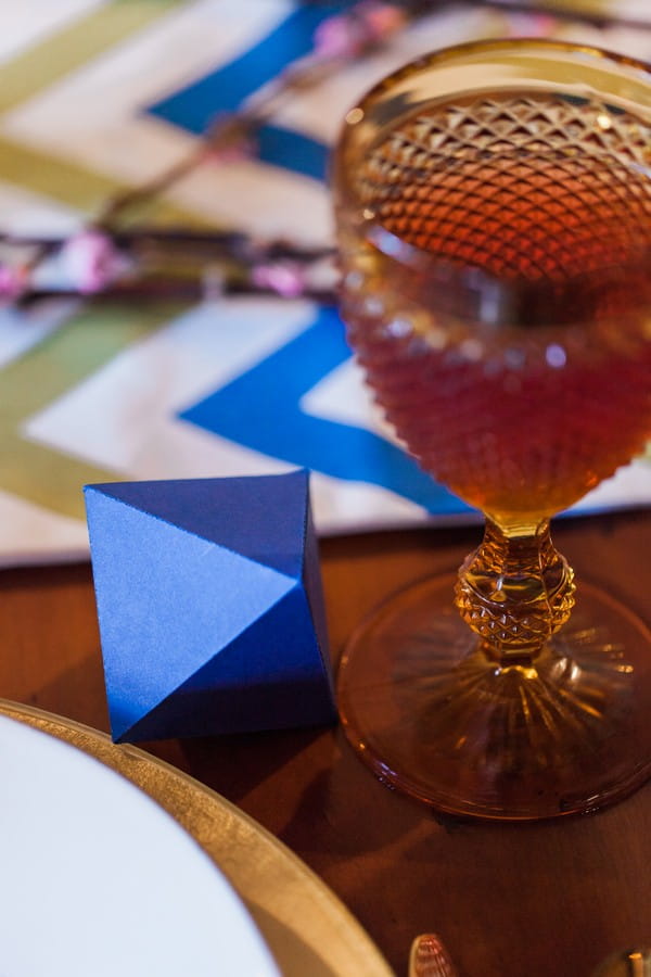 Blue octahedron geometric shape on wedding table