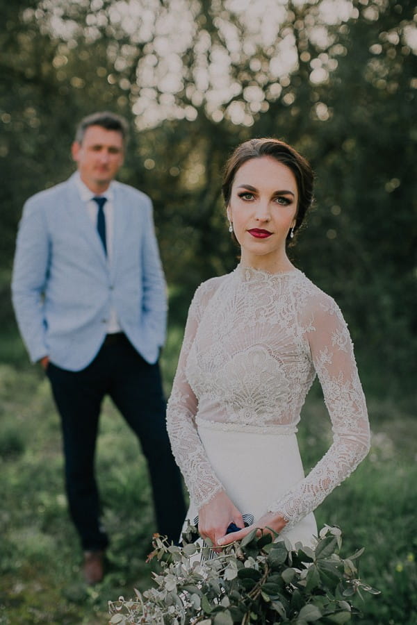 Bride with groom in background