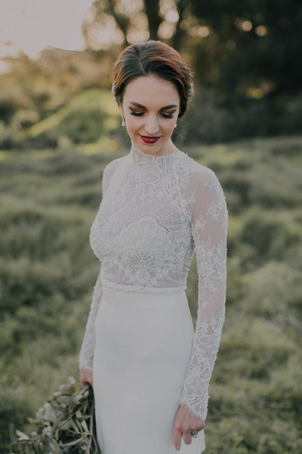 Bride wearing lace detailed dress