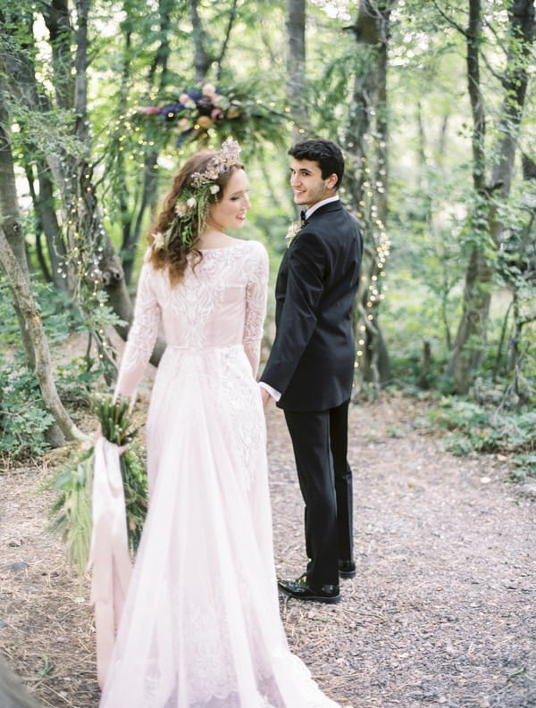 Bride and groom in woodland