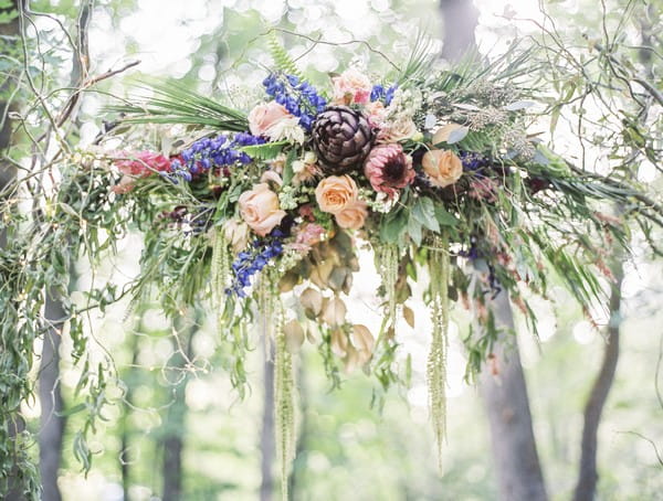 Floral display on wedding ceremony arch