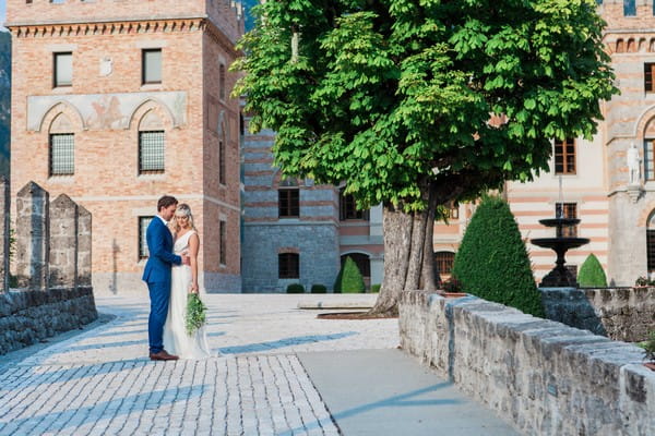 Bride and groom outside Count Ceconi Castle in Italy