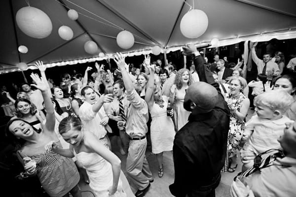 Wedding Guests Dancing with Arms in the Air