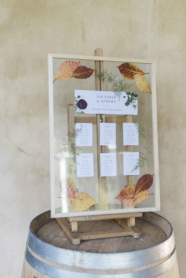 Clear wedding table plan with autumn leaves detail