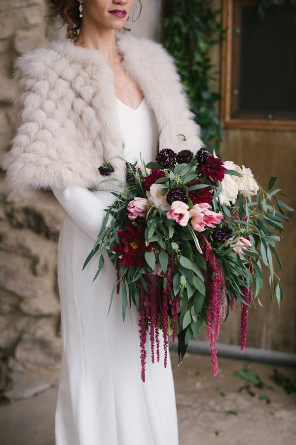 Bride holding winter wedding bouquet