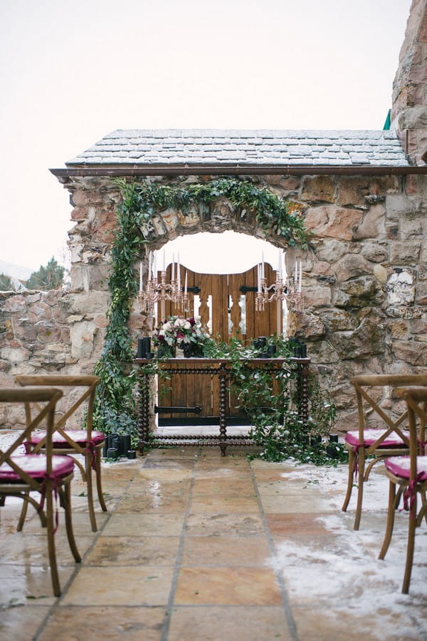 Winter wedding ceremony table in courtyard of Cherokee Castle