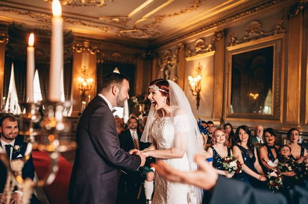 Bride with mouth open wide in excitement at having just got married - Picture by Andrea Ellison Photography