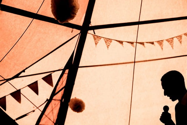 Silhouette of man giving wedding speech in tipi - Picture by Andrew Billington Photography