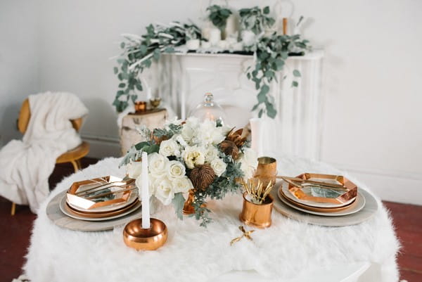 White and copper wedding table styling