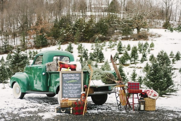 Back of truck full of vintage winter wedding decor