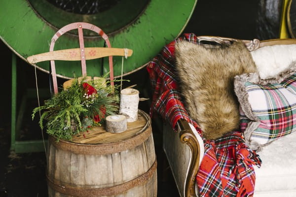 Barrel with candles and winter flowers