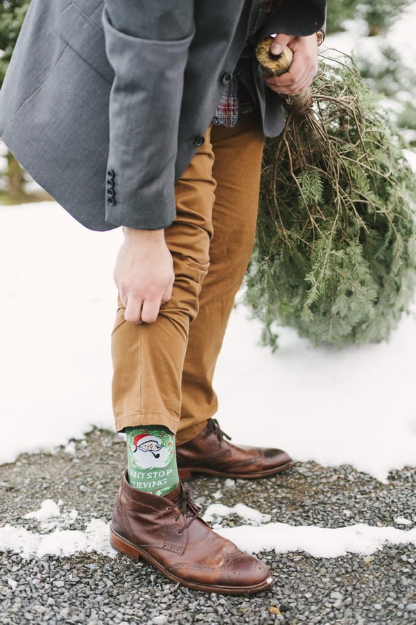 Groom wearing Christmas socks