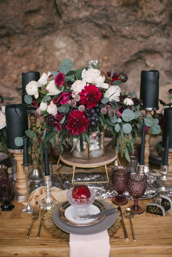 Wedding place setting with red, black and gold styling