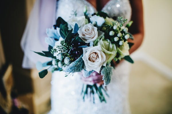 Winter Wedding Bouquet with Roses and Dark Green Leaves