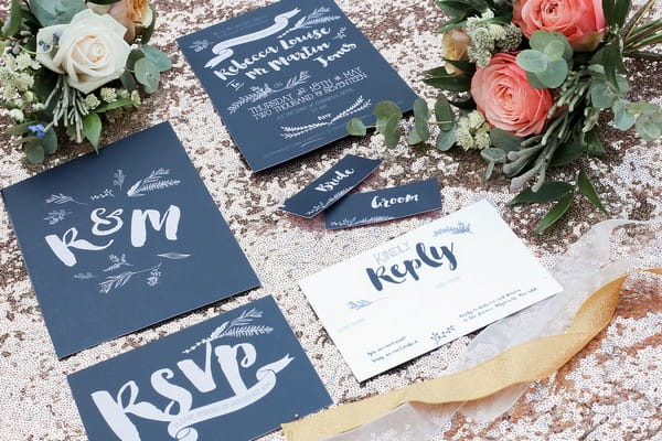 Dark blue wedding stationery with white lettering