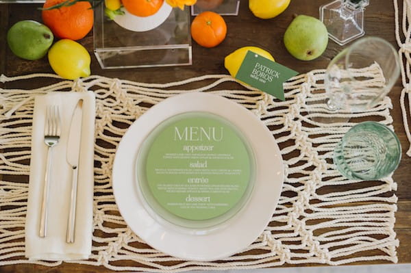 Round green wedding menu on plate