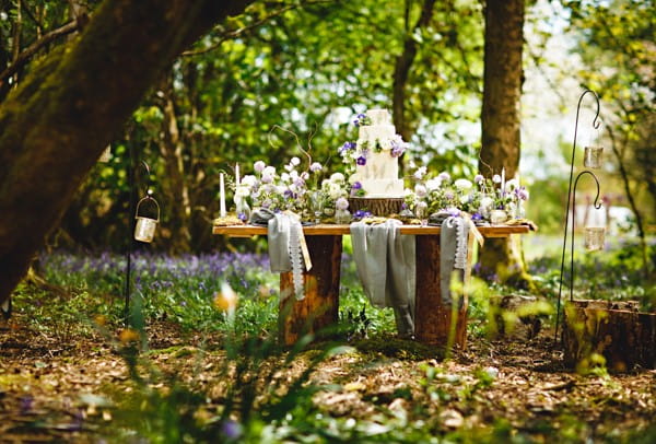 Table in woods with woodland wedding styling