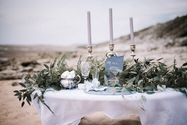 Naturally styled wedding table on beach