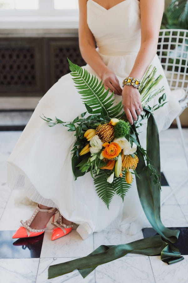 Bridal bouquet of bright flowers and foliage