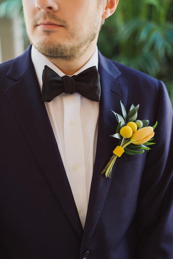 Groom's yellow tied style buttonhole