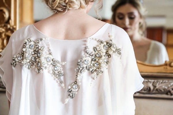 Crystal detail on back of bride's wedding dress