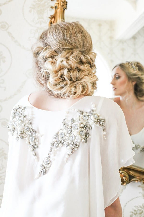 Back of bride's curled updo hairstyle