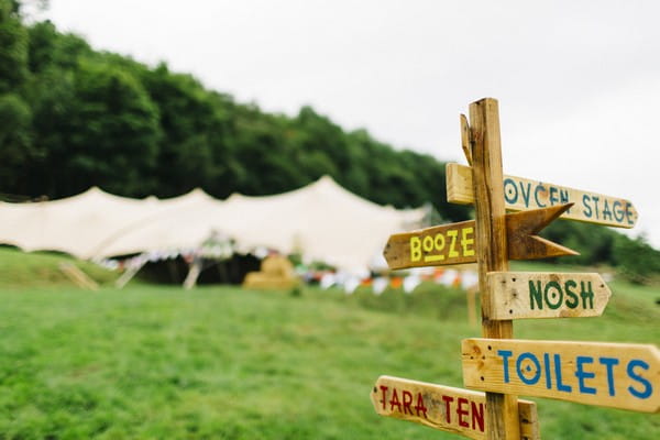 Wooden sign at festival wedding