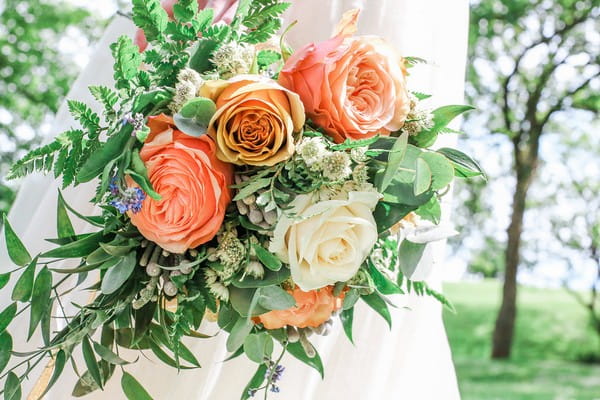 Wedding bouquet with blush pink and white roses