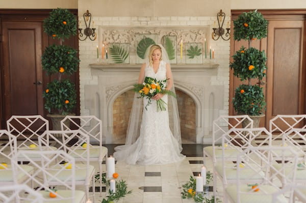 Bride standing in front of mantelpiece