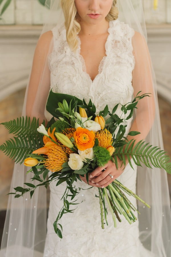 Bright orange flower and foliage bridal bouquet