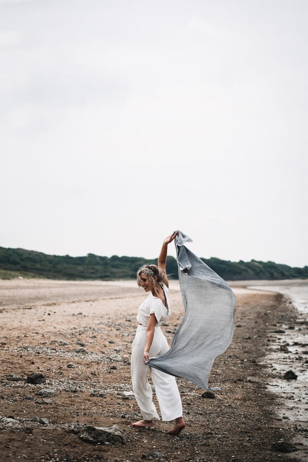 Bride on beach with shawl