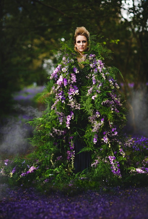 Bride wearing flower and foliage living cape