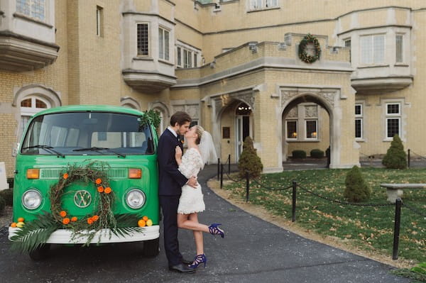 Bride and groom by green VW van