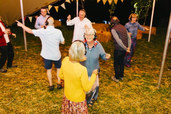 Wedding guests dancing to silent disco