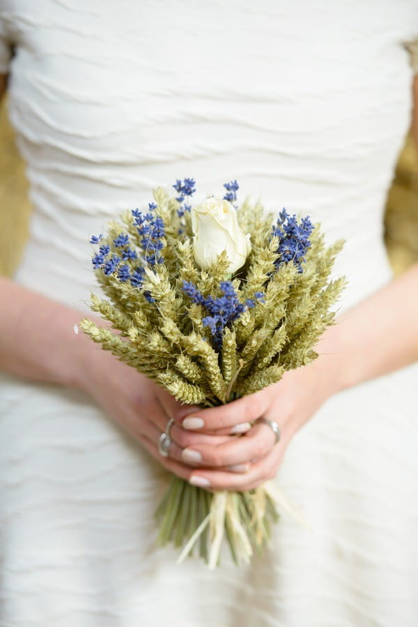 Bride Holding Lavender and Wheat Bouquet with Rose