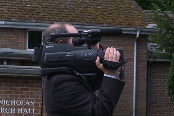 Videographer Filming Wedding